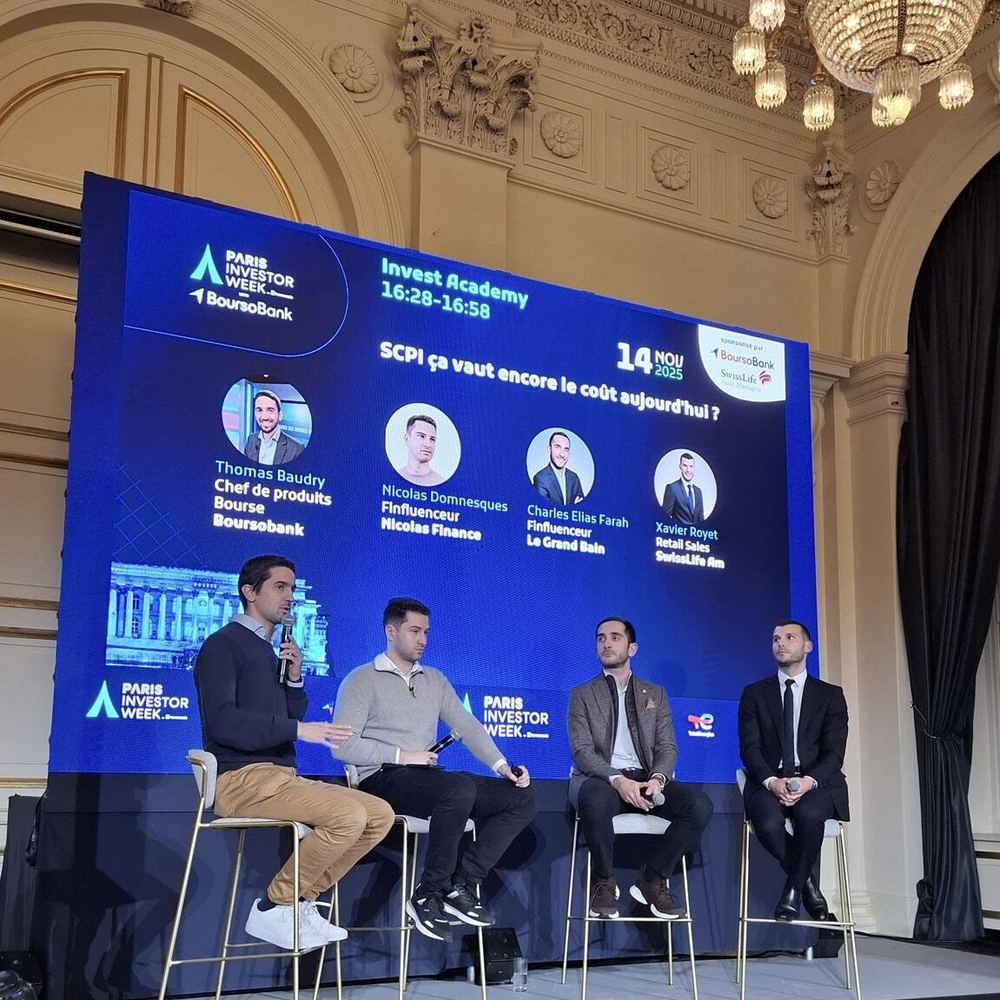 Nicolas on stage at Bourse de Paris, REITs investment panel in front of hundreds of professionals